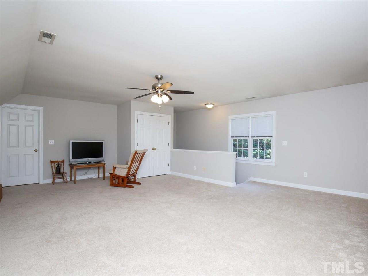 2329 Finley Ridge Lane Raleigh, NC 27615 - Photo 24 of 27 a view of a livingroom with a table and chairs