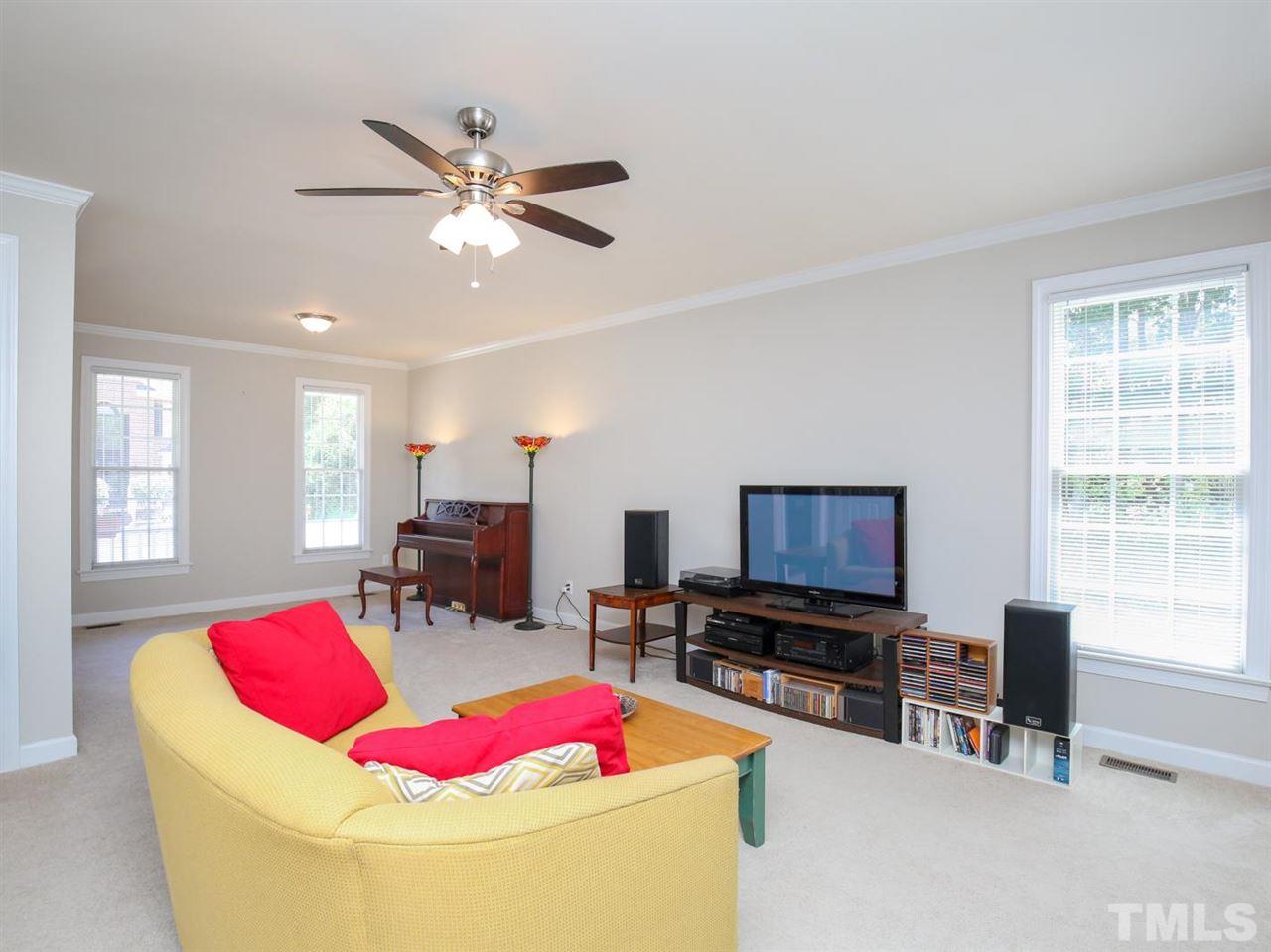 2329 Finley Ridge Lane Raleigh, NC 27615 - Photo 7 of 27 a living room with furniture and a flat screen tv