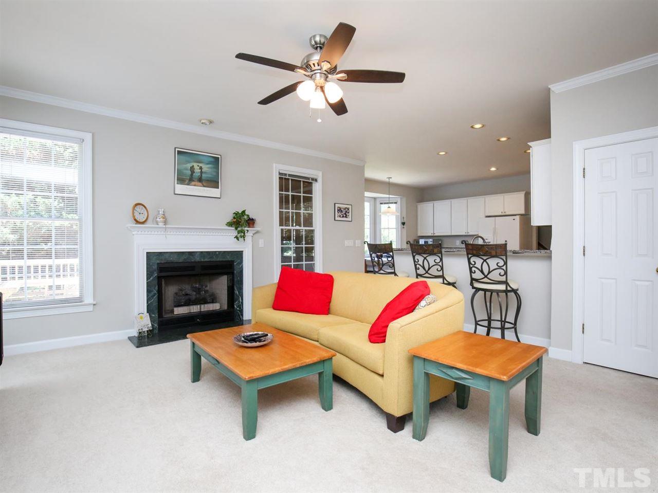 2329 Finley Ridge Lane Raleigh, NC 27615 - Photo 8 of 27 a living room with furniture and a fireplace