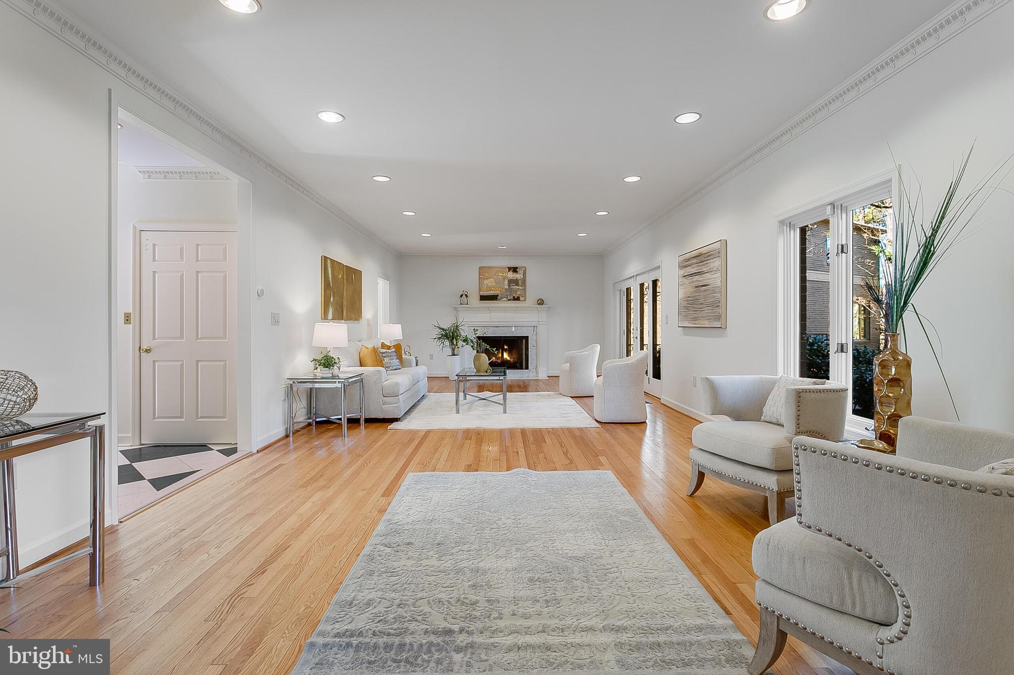 4709 Foxhall Crescent Northwest Washington, DC 20007 - Photo 17 of 57 Living room w/fireplace bathed in natural light