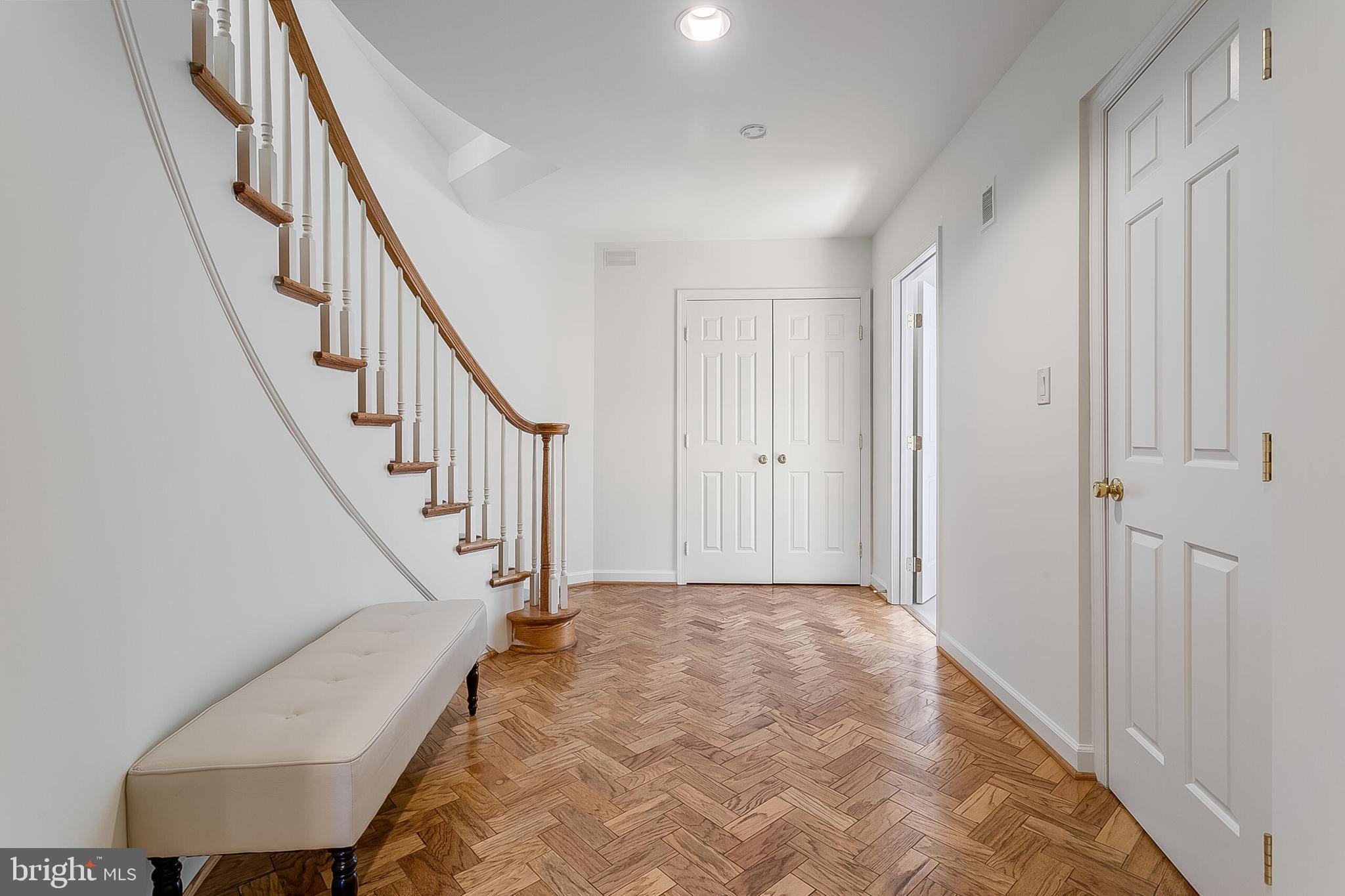4709 Foxhall Crescent Northwest Washington, DC 20007 - Photo 34 of 57 Lower level landing w/ herringbone hardwood floors