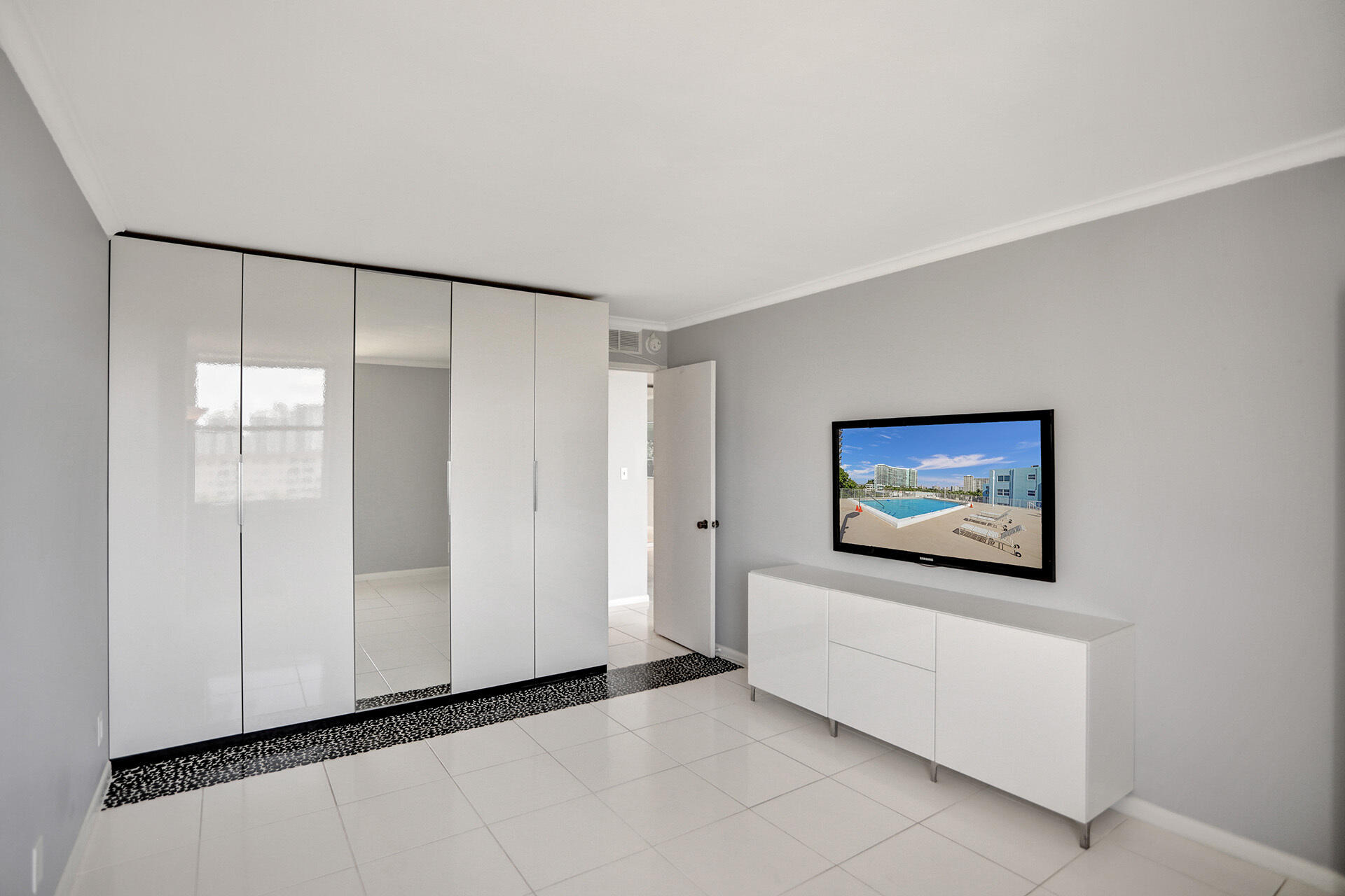 111 Briny Avenue, Unit 810 Pompano Beach, FL 33062 - Photo 14 of 62 a view of a livingroom with an empty space and a window