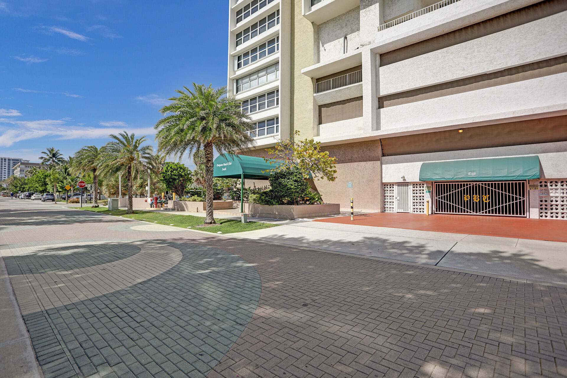 111 Briny Avenue, Unit 810 Pompano Beach, FL 33062 - Photo 41 of 62 a front view of a building with palm trees