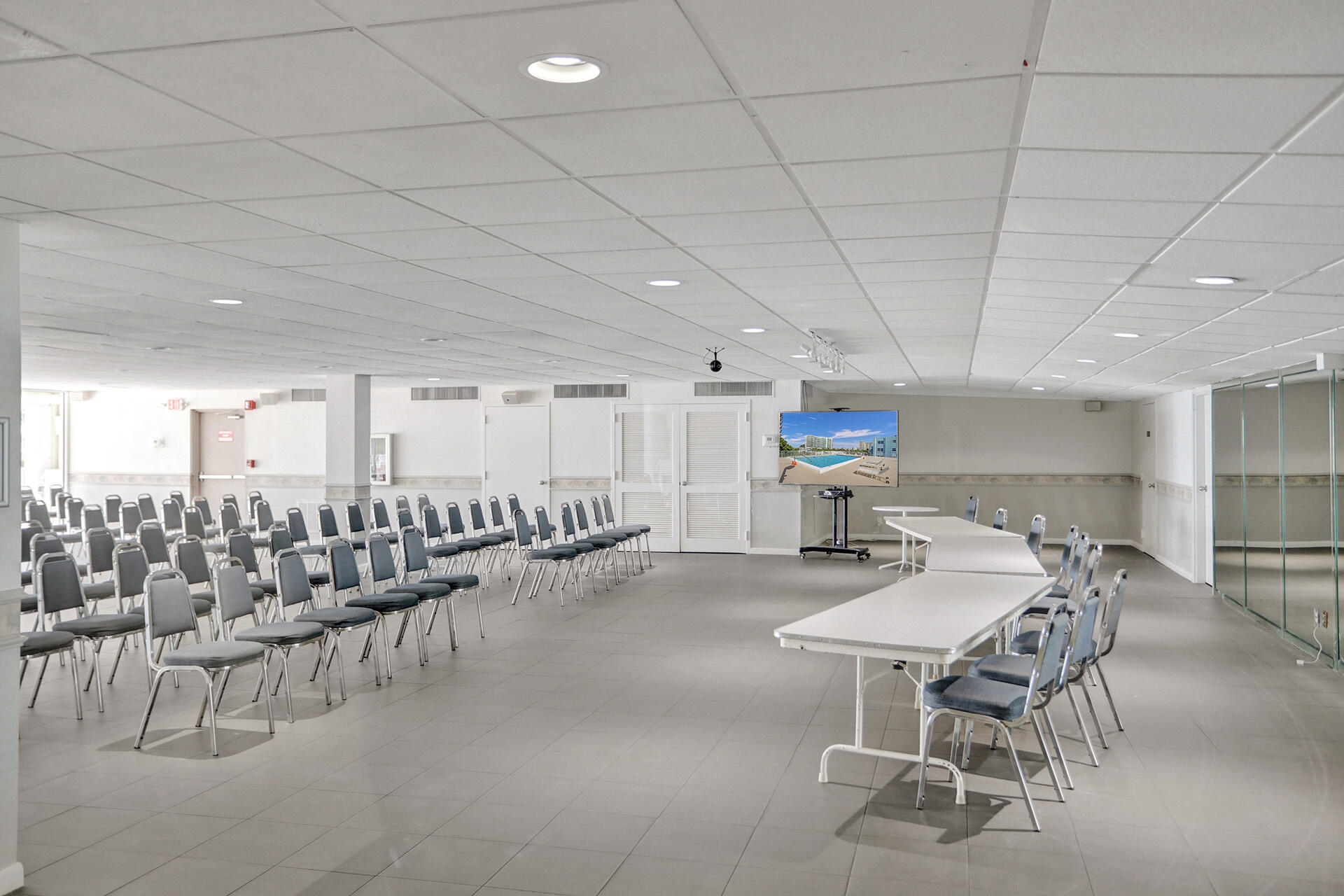 111 Briny Avenue, Unit 810 Pompano Beach, FL 33062 - Photo 59 of 62 a kitchen with a table and chairs in it