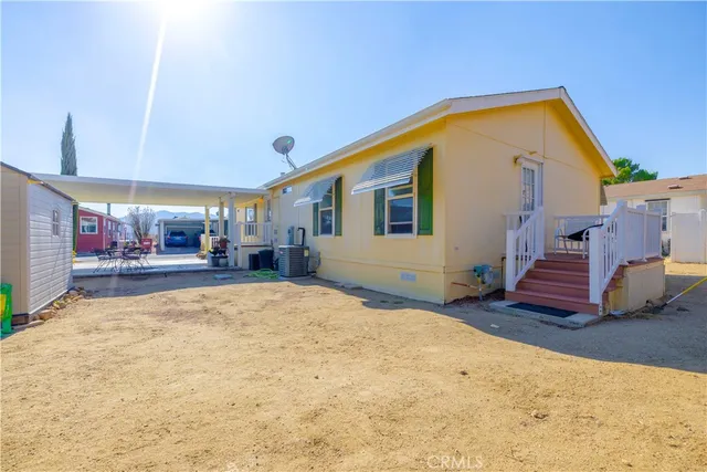a view of a house with a snow in the yard