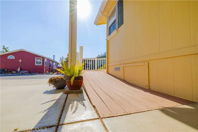 a view of balcony with wooden floor and furniture