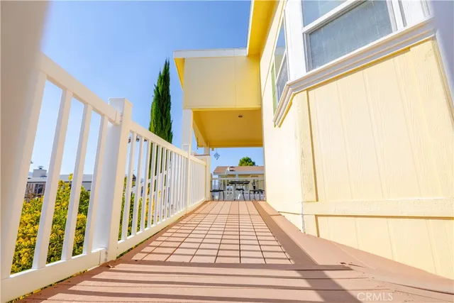 a view of balcony and wooden floor