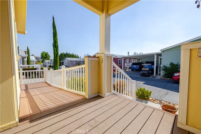 a kitchen with stainless steel appliances granite countertop a refrigerator a stove and a wooden cabinets