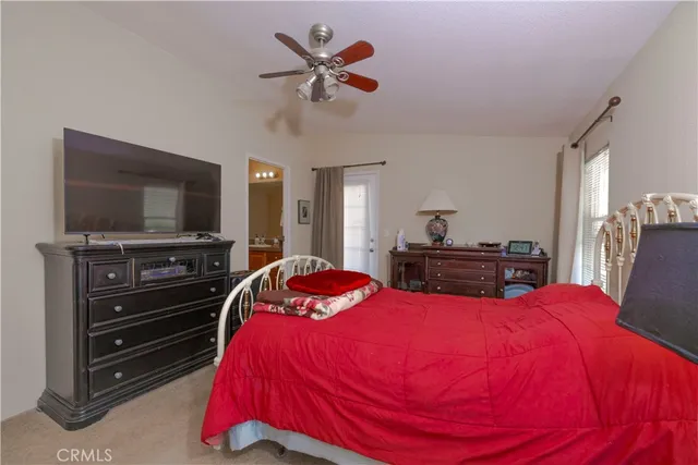 a bed room with a bed and a window