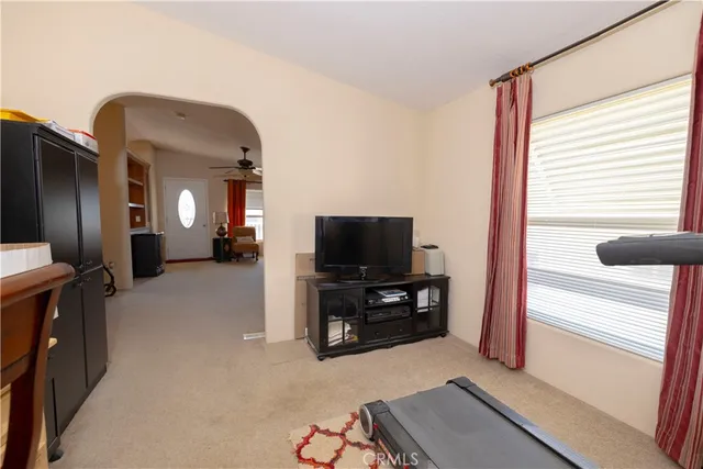 a view of a livingroom with furniture and a window