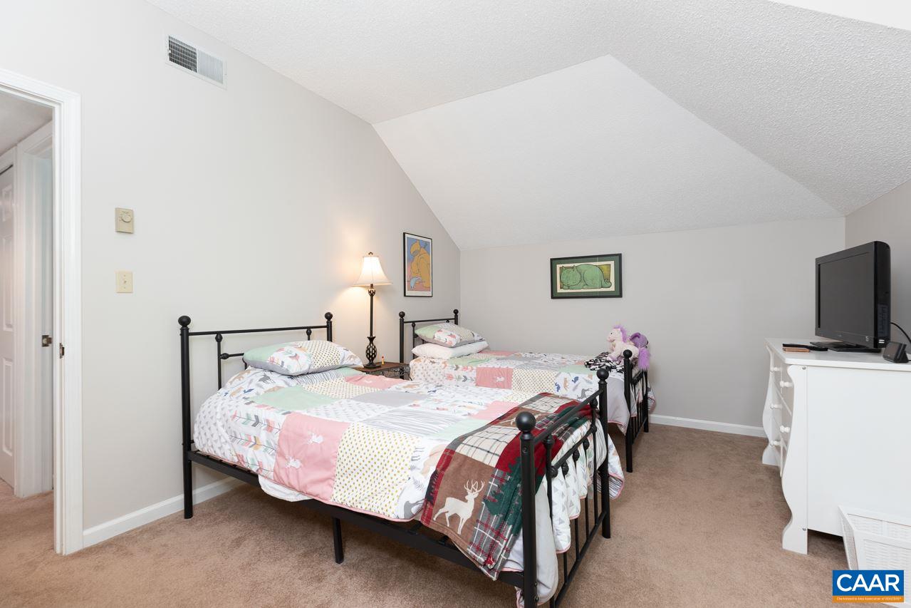2036 Stone Ridge Roseland, VA 22967 - Photo 14 of 18 a bedroom with a bed and a flat screen tv