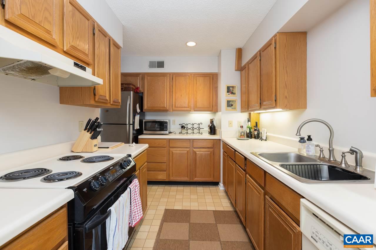 2036 Stone Ridge Roseland, VA 22967 - Photo 7 of 18 a kitchen with a sink stove top oven and cabinets