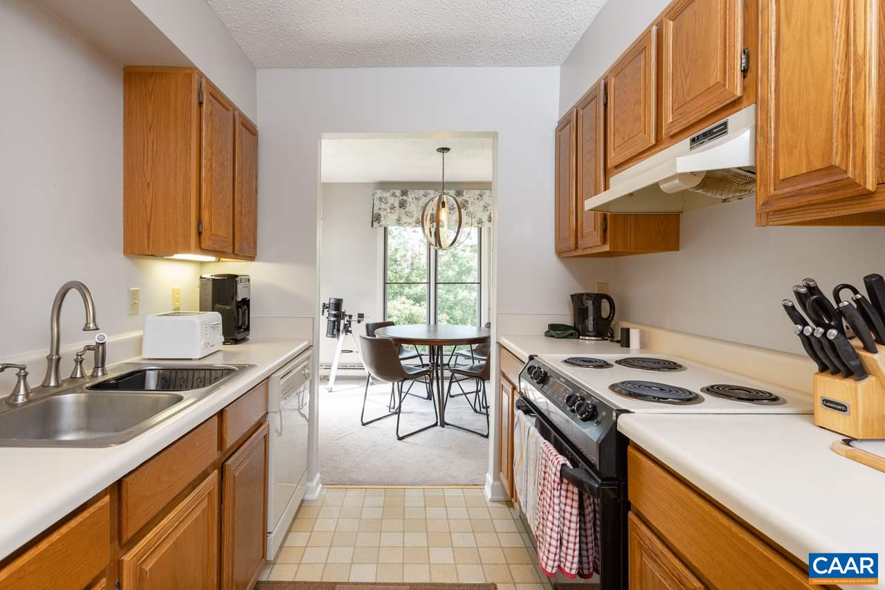 2036 Stone Ridge Roseland, VA 22967 - Photo 8 of 18 a kitchen with stainless steel appliances granite countertop a sink stove and refrigerator