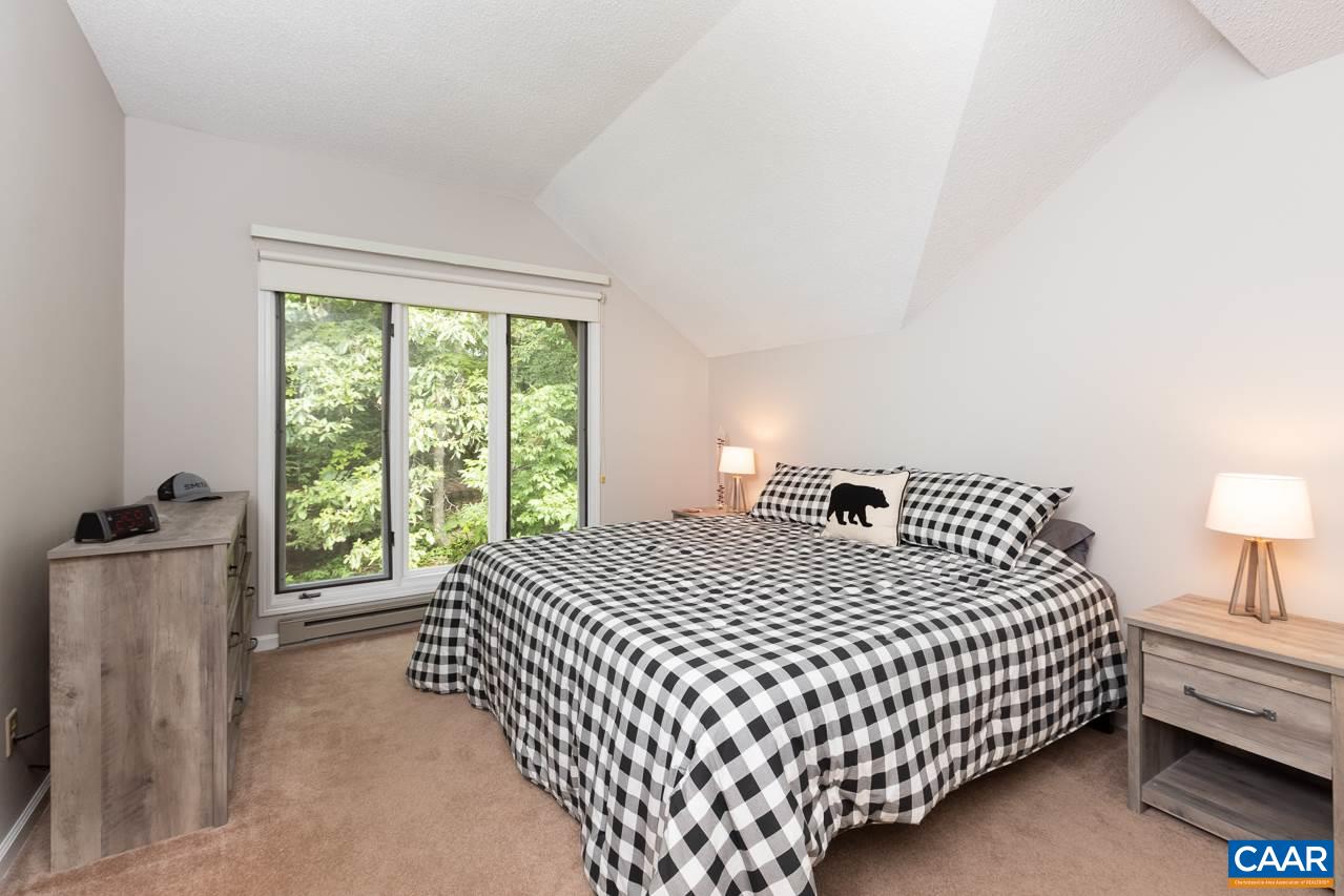 2036 Stone Ridge Roseland, VA 22967 - Photo 10 of 18 a bedroom with a bed and a dresser with mirror