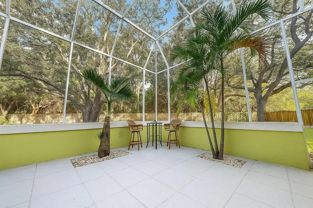 a view of a swimming pool with a patio and a yard