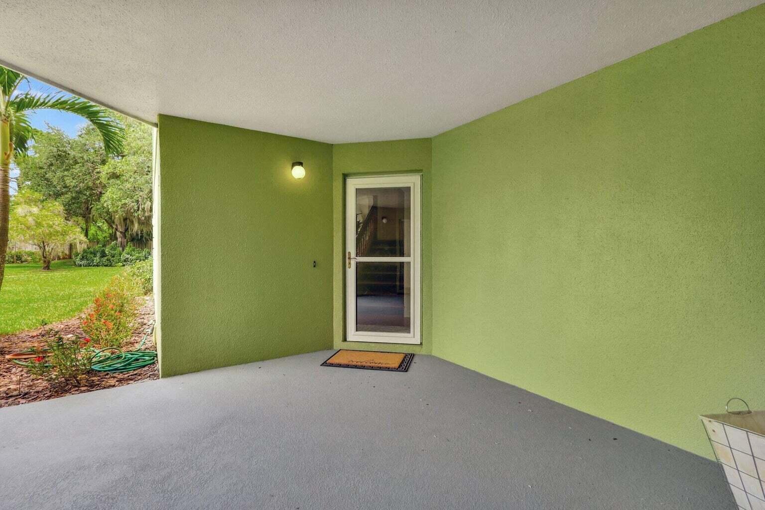 81 Southeast Beech Tree Lane Stuart, FL 34994 - Photo 7 of 27 a view of an empty room with a garden