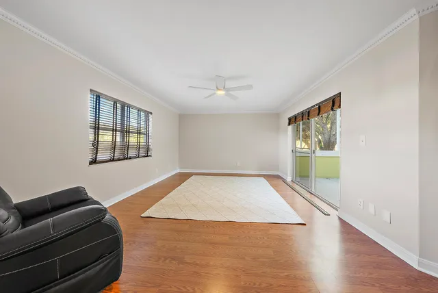 a living room with a couch and a window