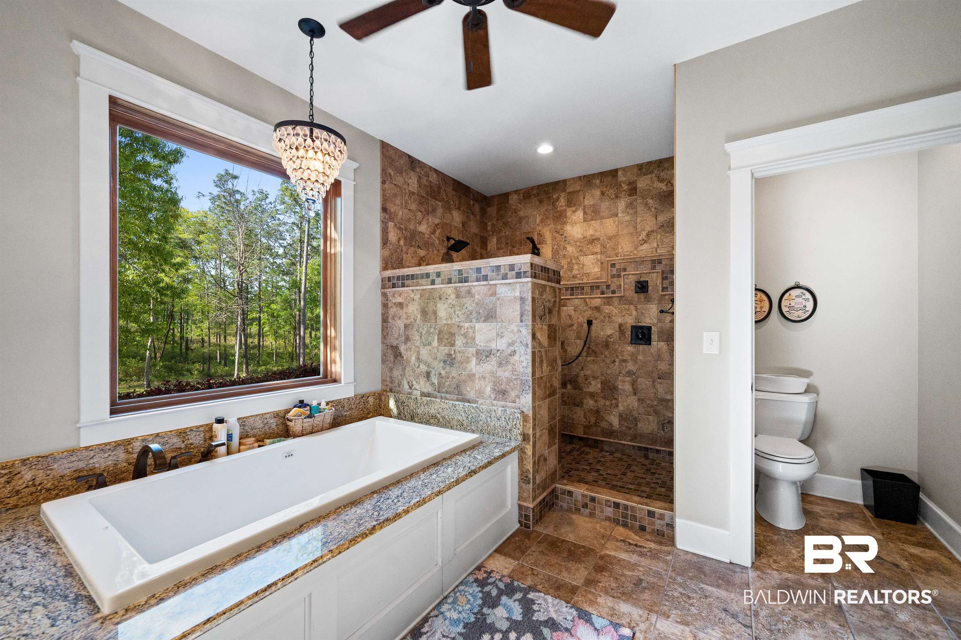 47252 Emmons Road Bay Minette, AL 36507 - Photo 21 of 50 Bathroom featuring walk in shower, dark stone finish flooring, ceiling fan, and a bath