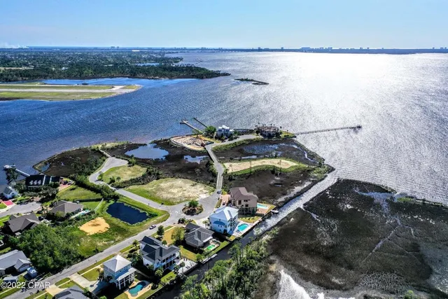 an aerial view of a house with a ocean view