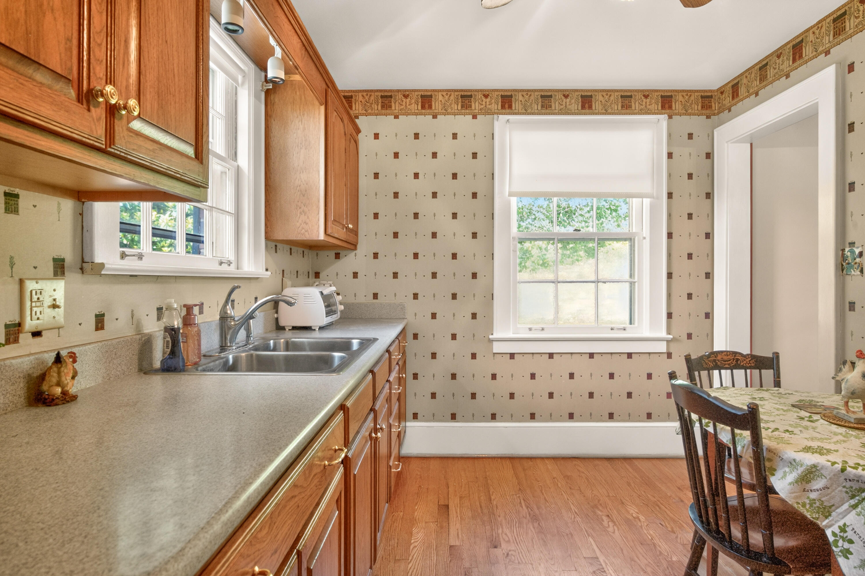 4322 Rosecrest Road Roanoke, VA 24018 - Photo 22 of 36 a kitchen with granite countertop a sink a stove a dining table and chairs