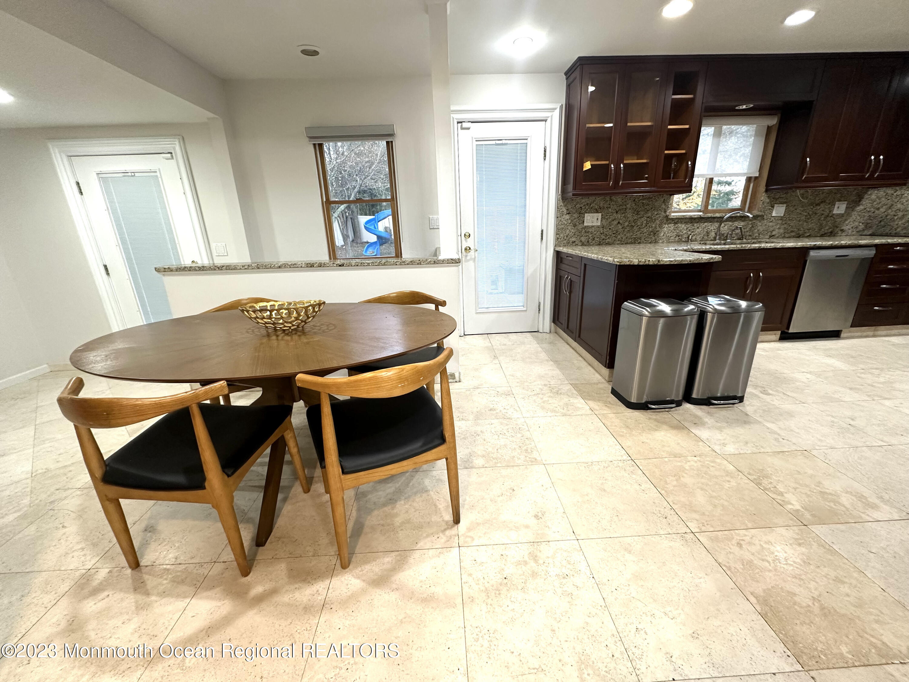 77 Pinewood Avenue West Long Branch, NJ 07764 - Photo 14 of 25 a dining hall with granite countertop a sink a counter top space and appliances