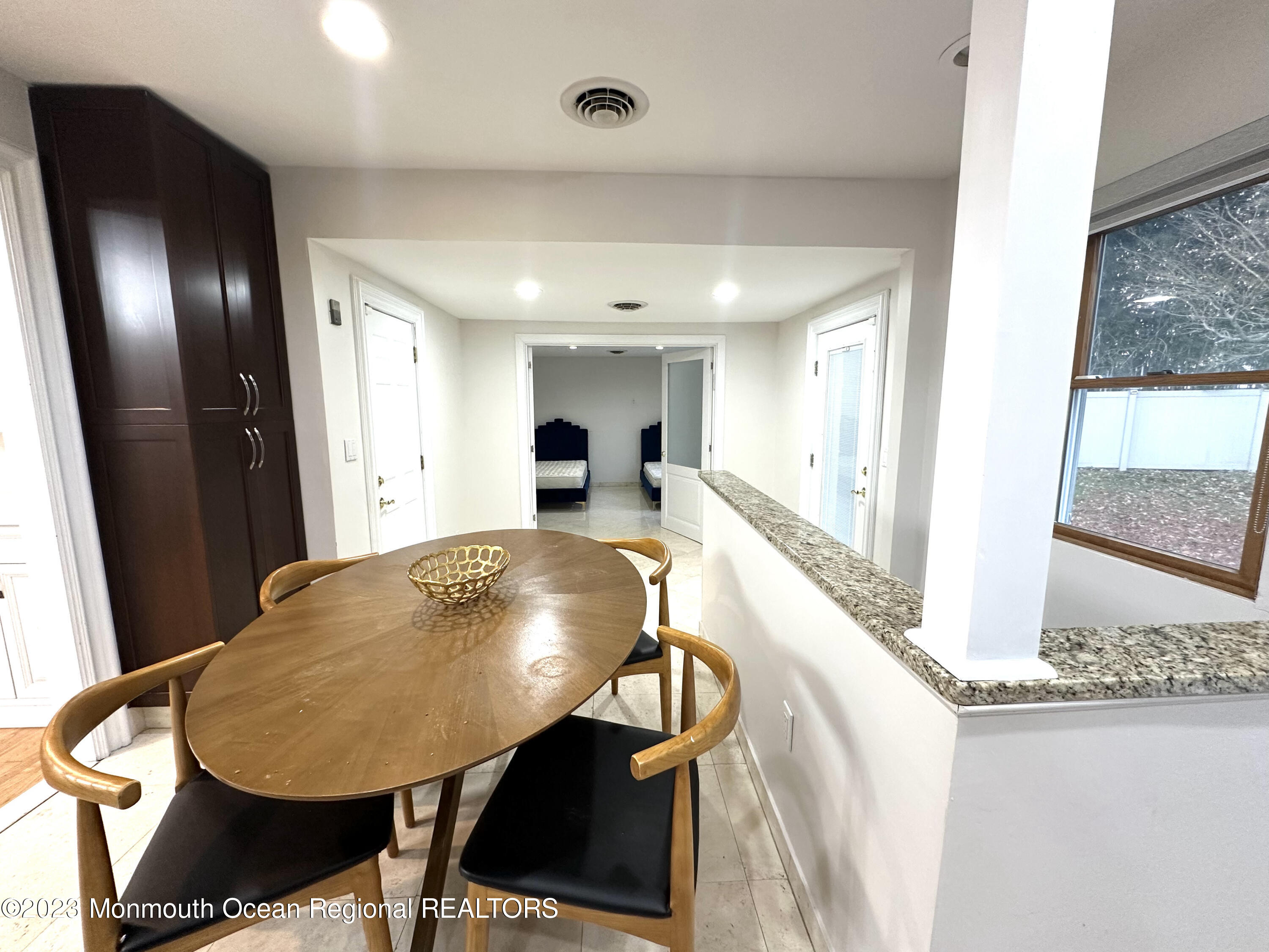 77 Pinewood Avenue West Long Branch, NJ 07764 - Photo 15 of 25 a living room with furniture and a table