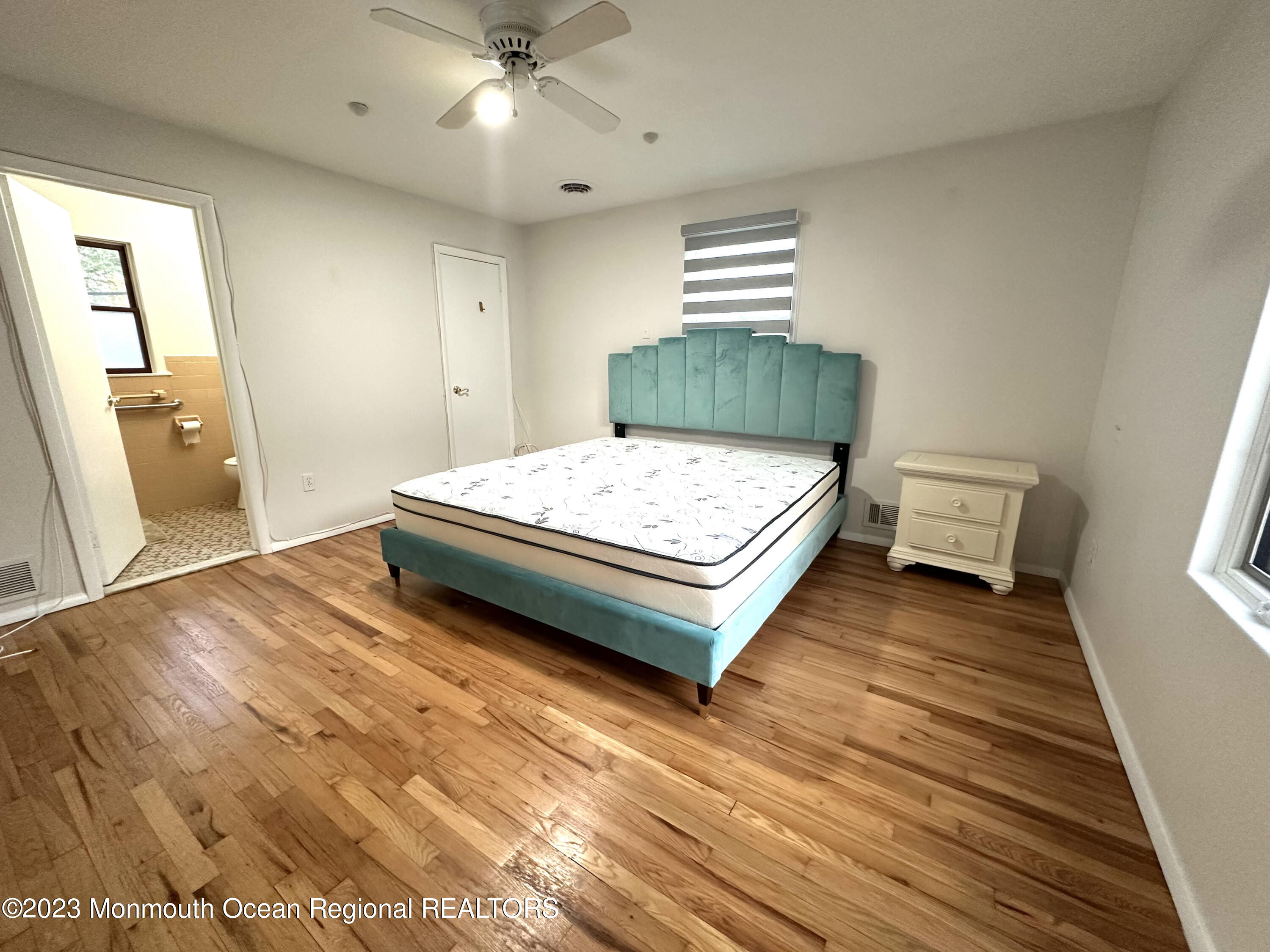 77 Pinewood Avenue West Long Branch, NJ 07764 - Photo 17 of 25 a bedroom with a bed and window