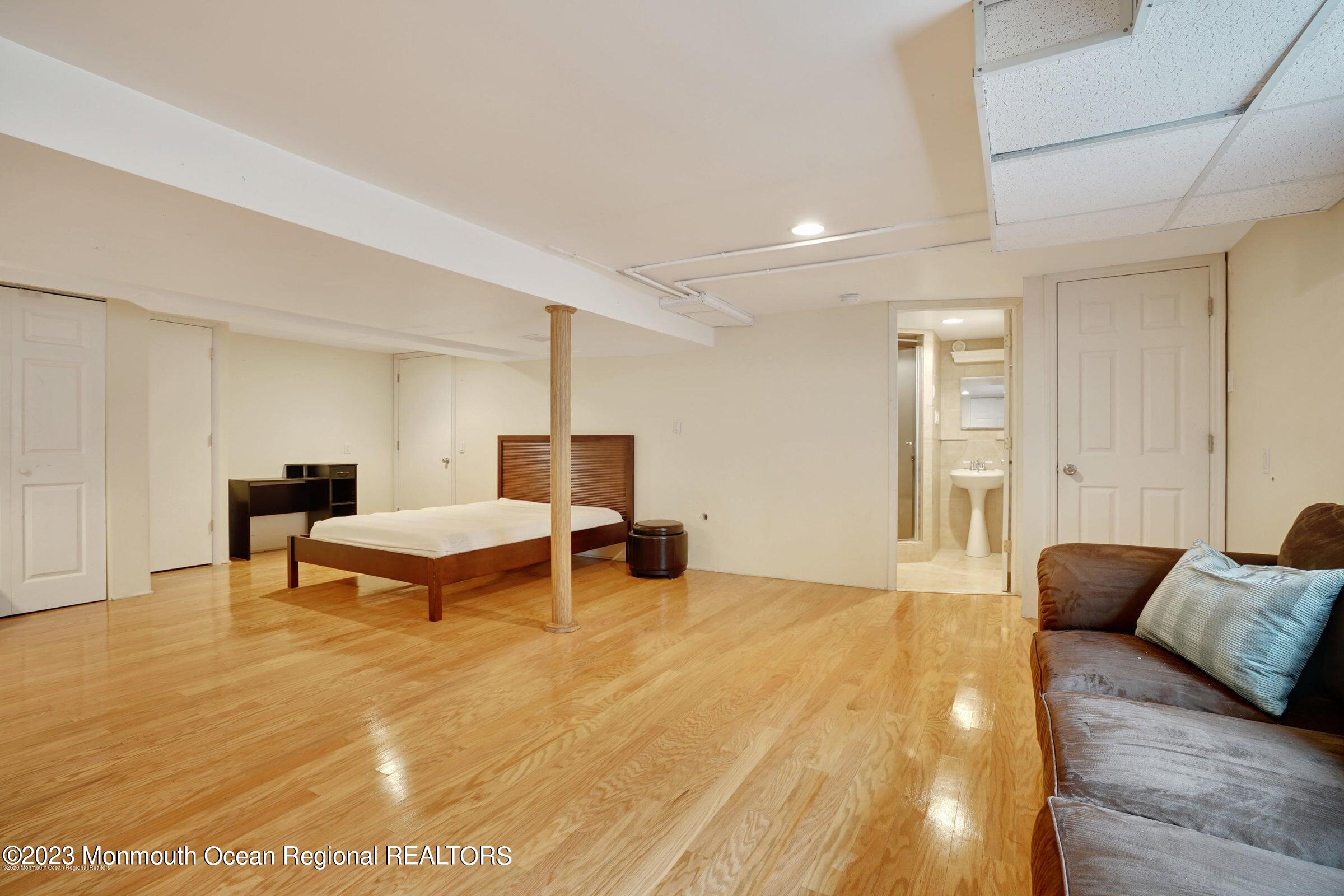 77 Pinewood Avenue West Long Branch, NJ 07764 - Photo 18 of 25 a living room with furniture and a table