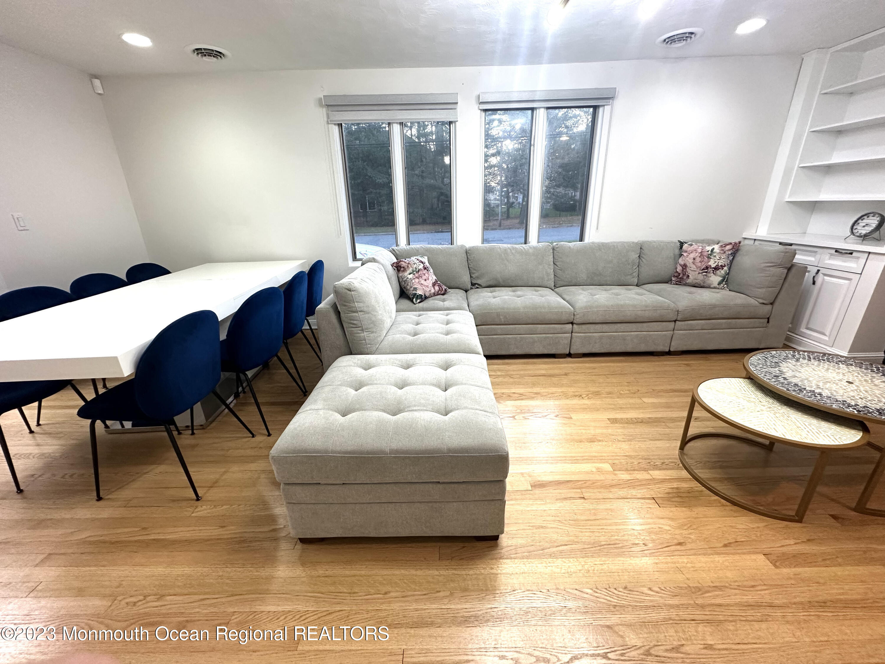 77 Pinewood Avenue West Long Branch, NJ 07764 - Photo 4 of 25 a living room with furniture and a large window