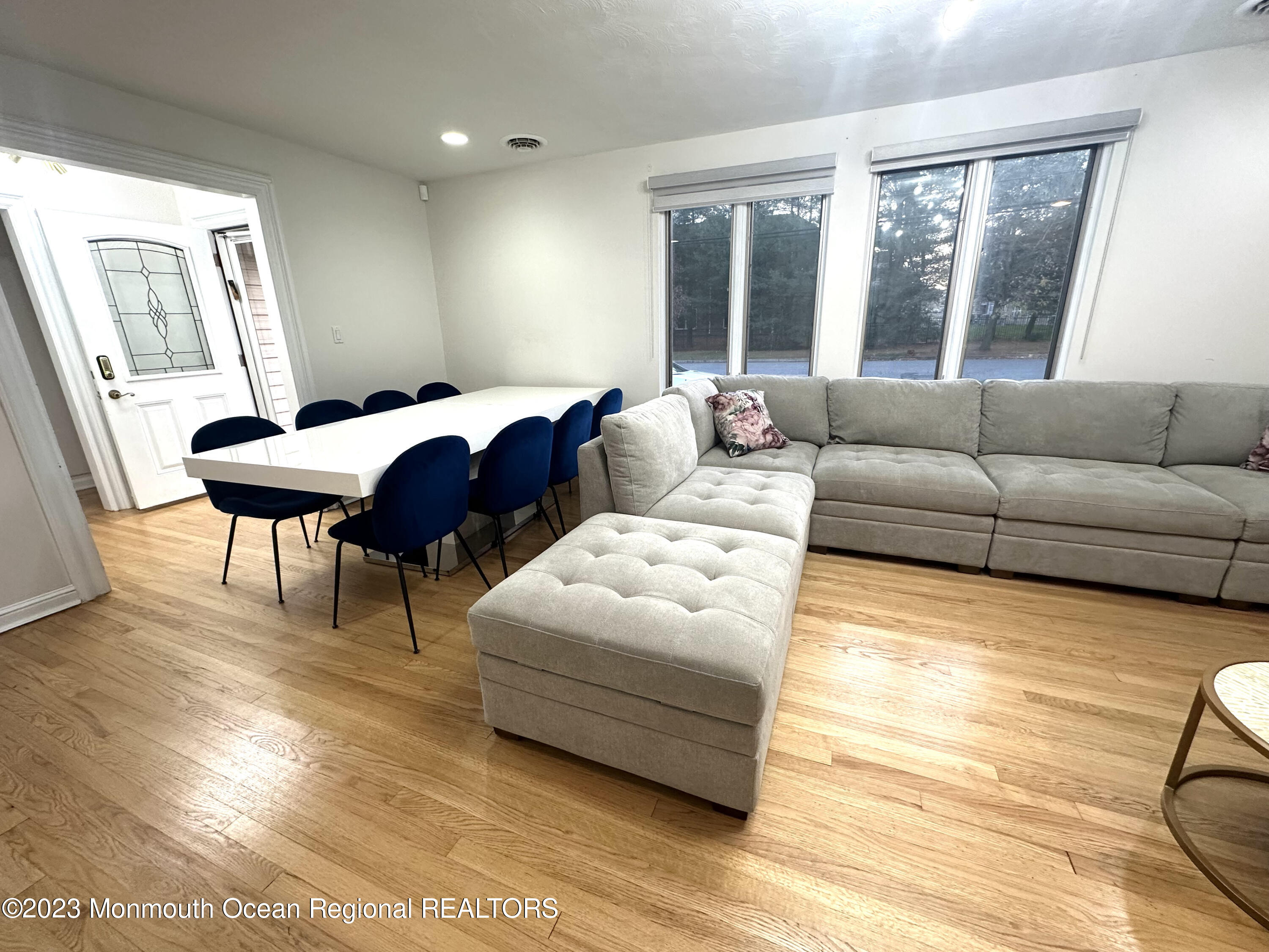 77 Pinewood Avenue West Long Branch, NJ 07764 - Photo 6 of 25 a living room with furniture and a large window