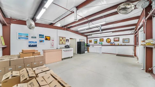 a room with lots of white furniture and appliances