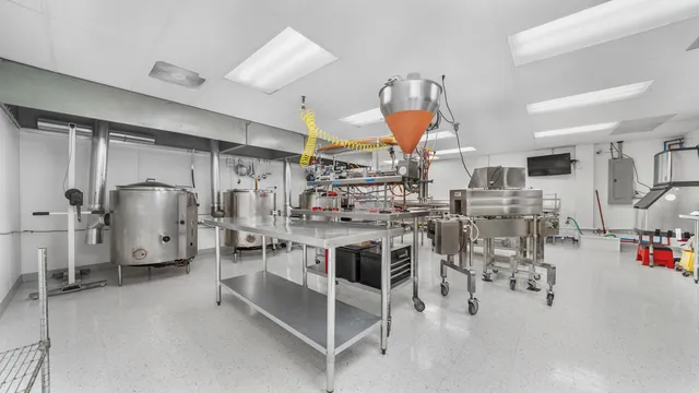 a living room with lots of furniture and clutter