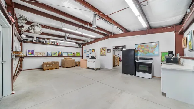 a view of a garage with table and chairs