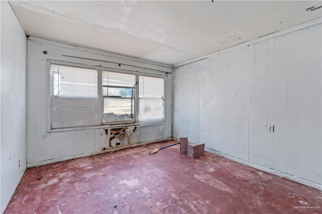 18301 Primera Road Harlingen, TX 78552 - Photo 7 of 15 a view of an empty room with a window