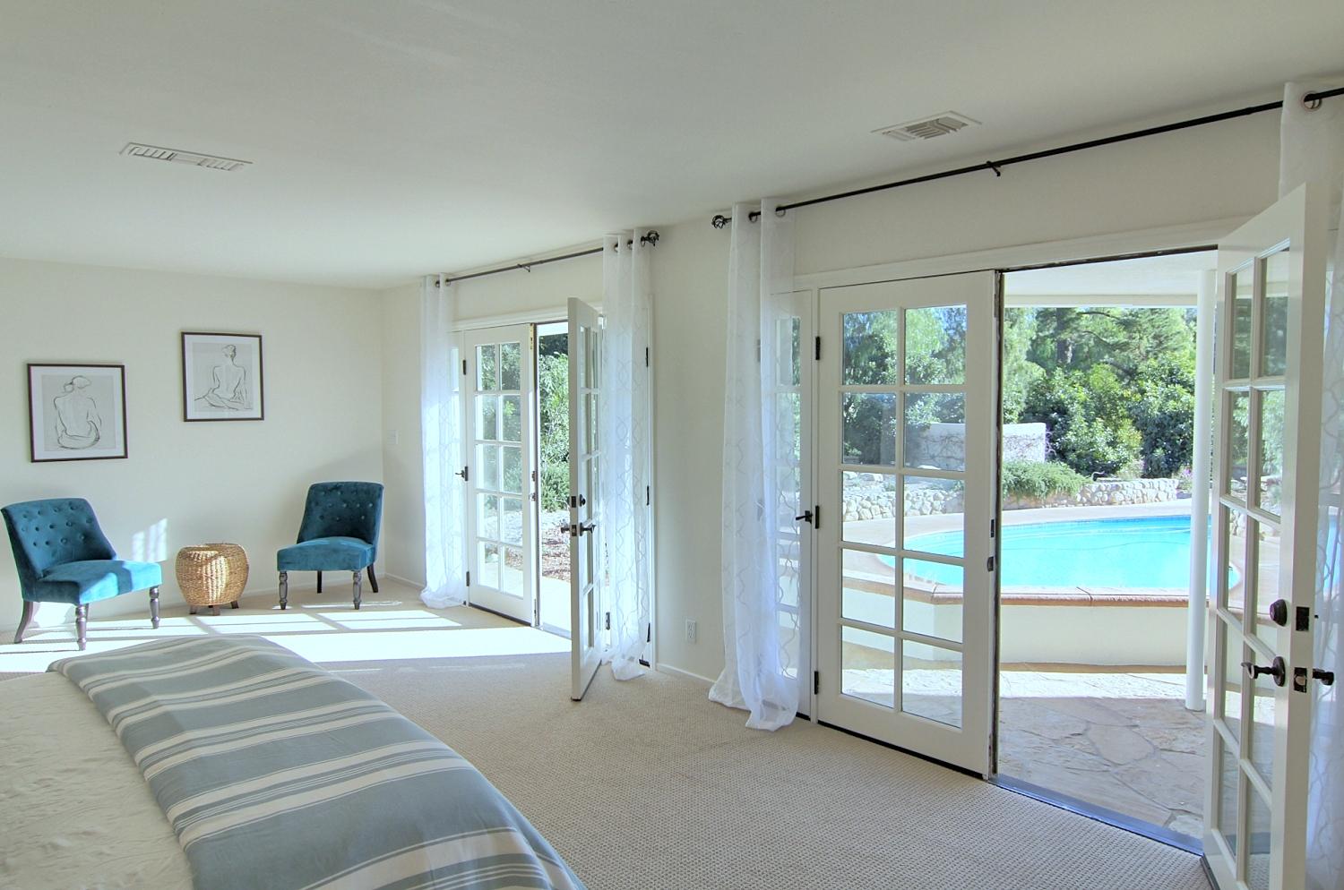 1674 Ladera Road Ojai, CA 93023 - Photo 16 of 47 a bedroom with a bed and large window