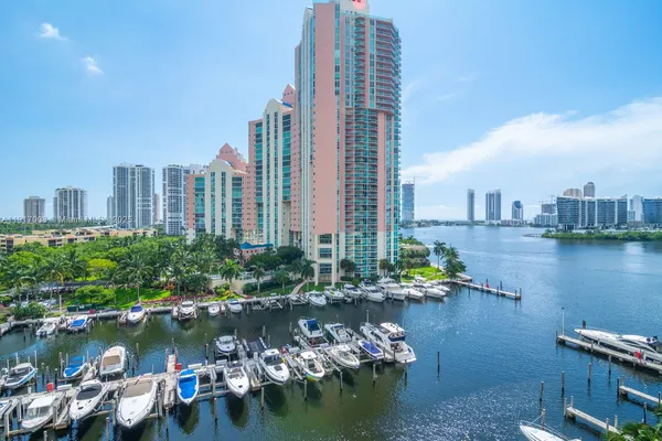 a view of lake and city with tall buildings