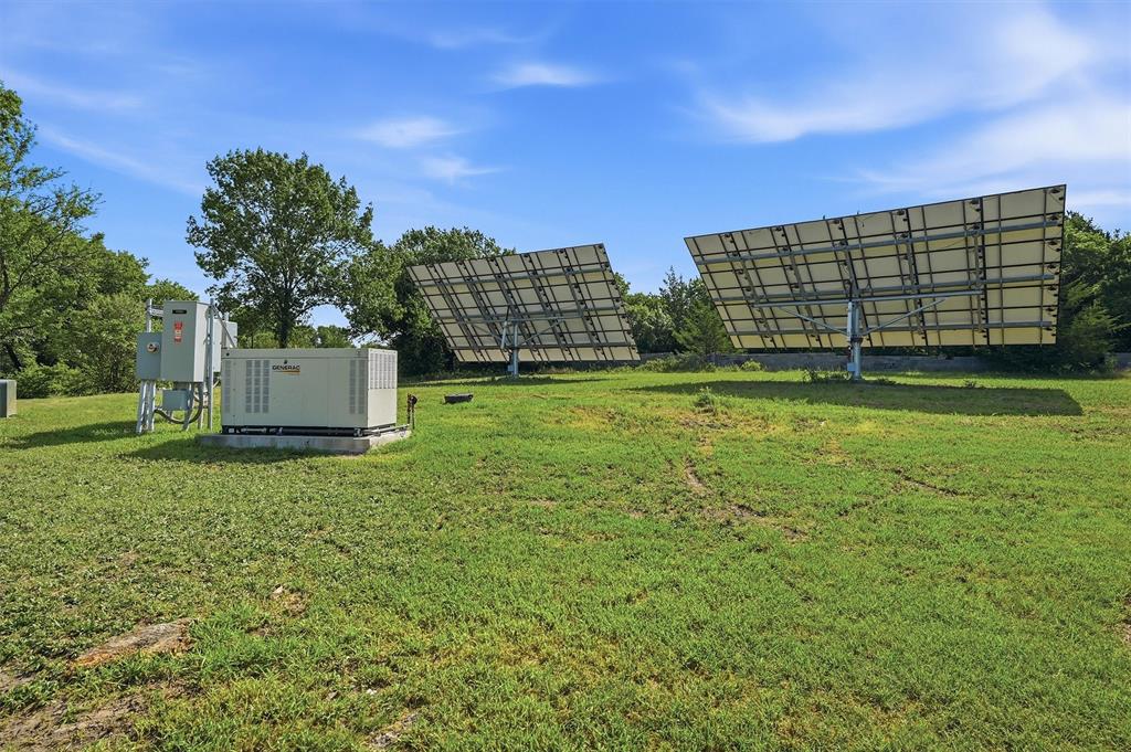 3260 Bethel-Cannon Road Van Alstyne, TX 75495 - Photo 39 of 40 Ground-mounted solar panels and a generator system provide alternative power solutions