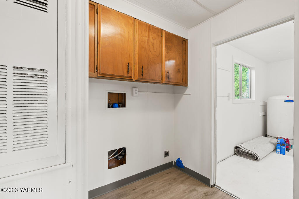 70 Albro Road Sunnyside, WA 98944 - Photo 21 of 33 a view of a room with wooden floor and cabinet