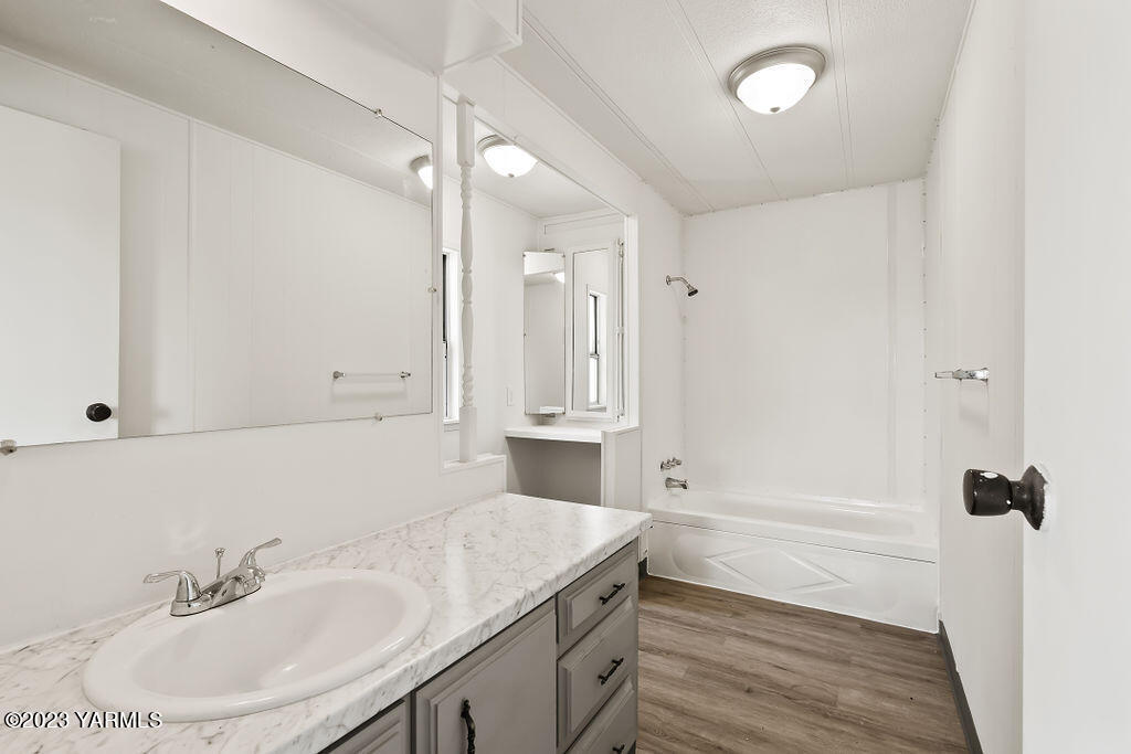 70 Albro Road Sunnyside, WA 98944 - Photo 10 of 33 a bathroom with a sink and a mirror