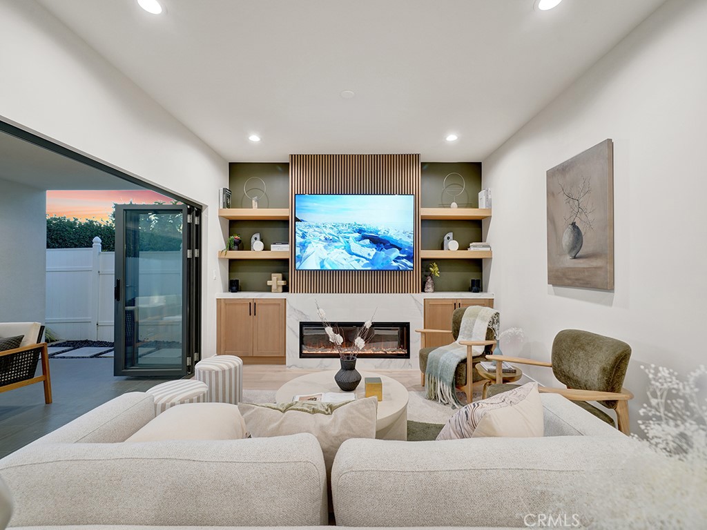 4652 Charnock Drive Irvine, CA 92604 - Photo 15 of 51 a living room with furniture and a flat screen tv