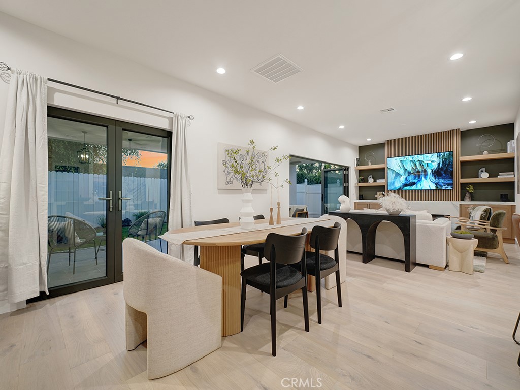 4652 Charnock Drive Irvine, CA 92604 - Photo 19 of 51 a living room with furniture a large window and potted plants