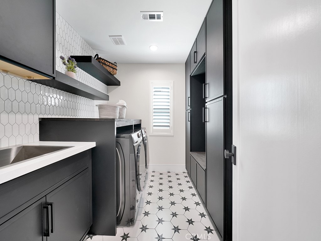 4652 Charnock Drive Irvine, CA 92604 - Photo 21 of 51 a hallway with front door and stairs