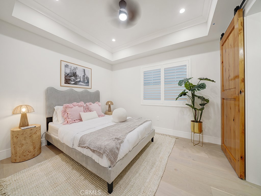 4652 Charnock Drive Irvine, CA 92604 - Photo 22 of 51 a bedroom with a bed and hallway