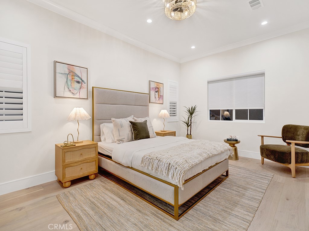 4652 Charnock Drive Irvine, CA 92604 - Photo 31 of 51 a bedroom with a bed and wooden floor