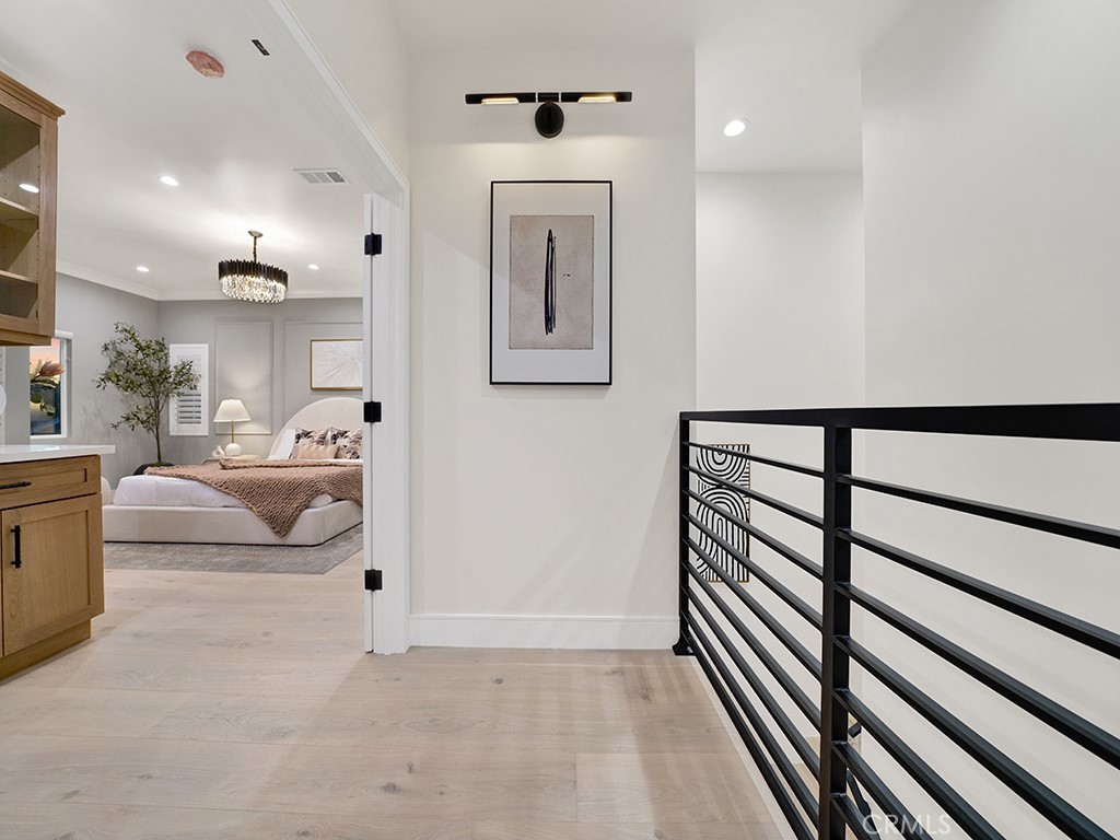 4652 Charnock Drive Irvine, CA 92604 - Photo 34 of 51 a view of a hallway with the couches and dining table