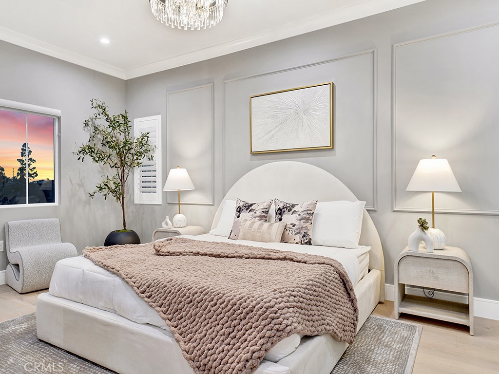 4652 Charnock Drive Irvine, CA 92604 - Photo 37 of 51 a bedroom with a bed and a lamp