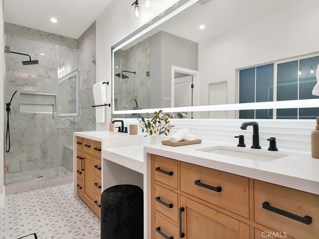 4652 Charnock Drive Irvine, CA 92604 - Photo 42 of 51 a bathroom with a sink double vanity and a shower