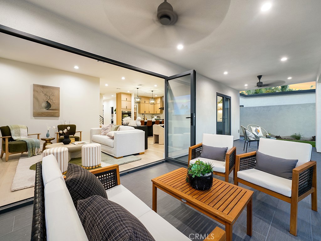 4652 Charnock Drive Irvine, CA 92604 - Photo 46 of 51 a living room with furniture and a table
