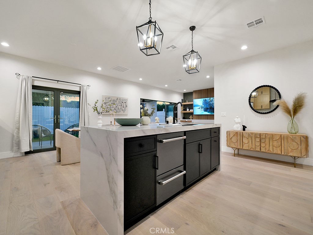4652 Charnock Drive Irvine, CA 92604 - Photo 5 of 51 a kitchen with stainless steel appliances granite countertop a stove and cabinets