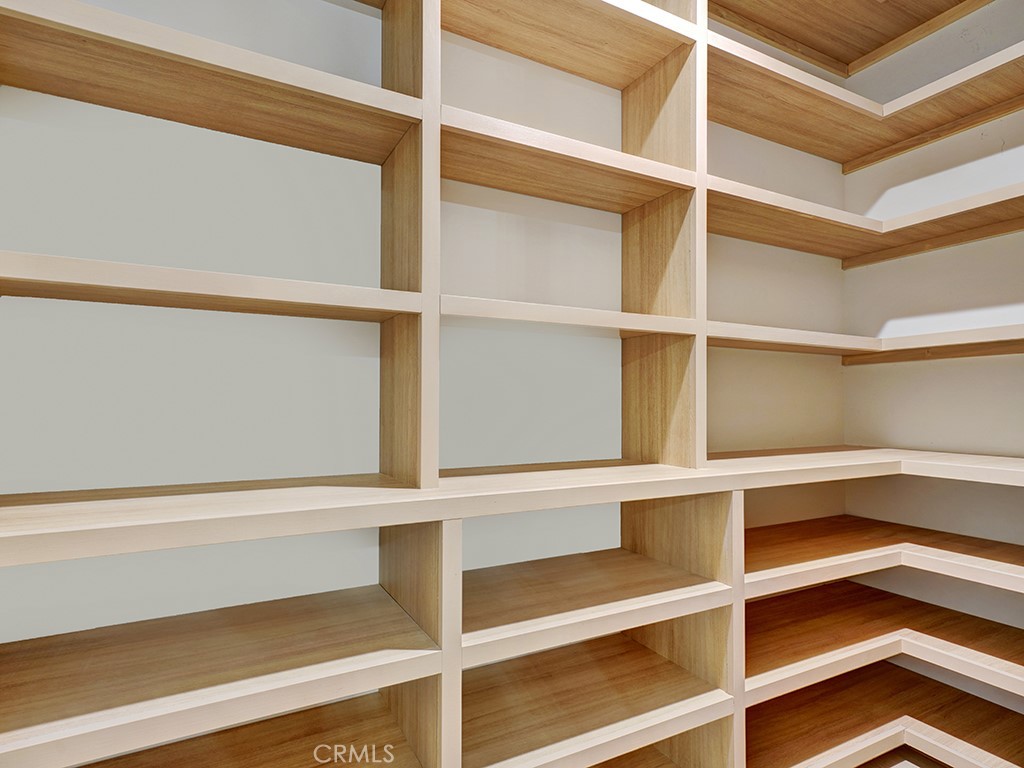 4652 Charnock Drive Irvine, CA 92604 - Photo 10 of 51 a view of walk in closet with empty racks